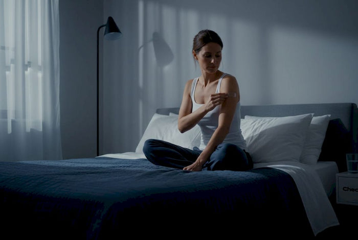 Evening routine applying sleep patch on arm