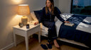 Woman preparing for sleep in calm bedroom