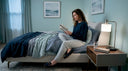 Woman reading in cozy evening bedroom