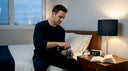 Man getting ready for sleep with supplements at bedside