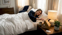 Woman opens subscription sleep kit in bedroom