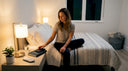 Woman sets alarm in calm bedroom nightly