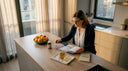 Woman reading about B vitamins and sleep at kitchen table
