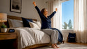 Woman stretching on bed in morning light