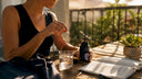 Woman taking vitamin B6 B12 supplement at kitchen table