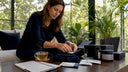 Woman comparing wellness products at kitchen table