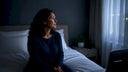 Woman awake in bed at night, restless