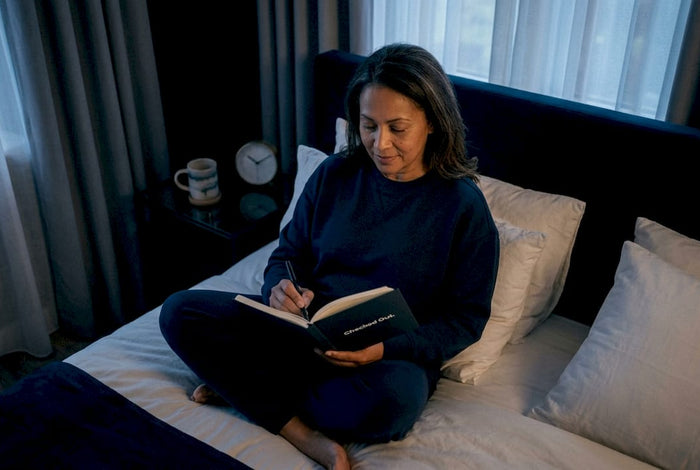 Woman journaling sleep health morning routine