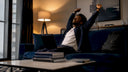 Worker stretching at desk after work