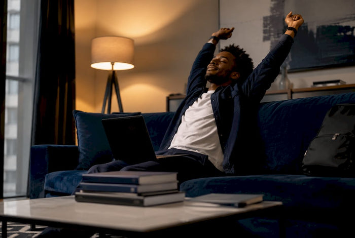 Worker stretching at desk after work