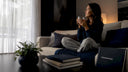 Woman drinking water in morning kitchen