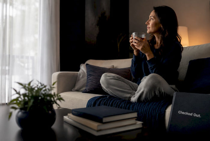Woman drinking water in morning kitchen