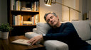 Man wearing sleep tracker lying in bed